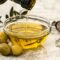 Olio extravergine di oliva italiano con foglie di ulivo - Frantoio Gentili Farnese
